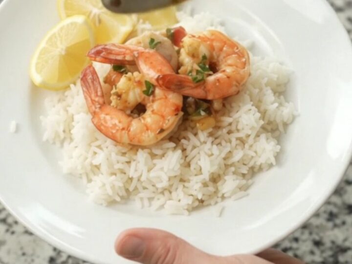 Slow cooker seafood boil with snow crab, shrimp, corn, and potatoes in chili-lime butter sauce