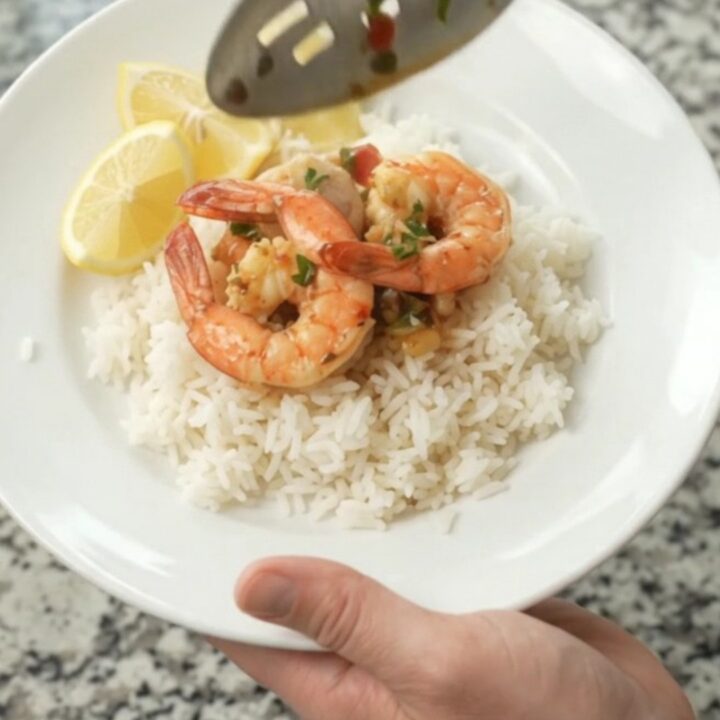 Slow cooker seafood boil with snow crab, shrimp, corn, and potatoes in chili-lime butter sauce