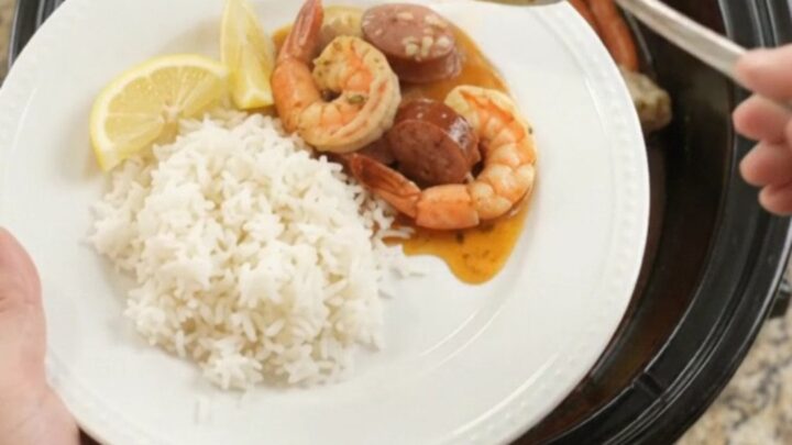 Snow crab, shrimp, and andouille sausage in a slow cooker with spiced butter sauce