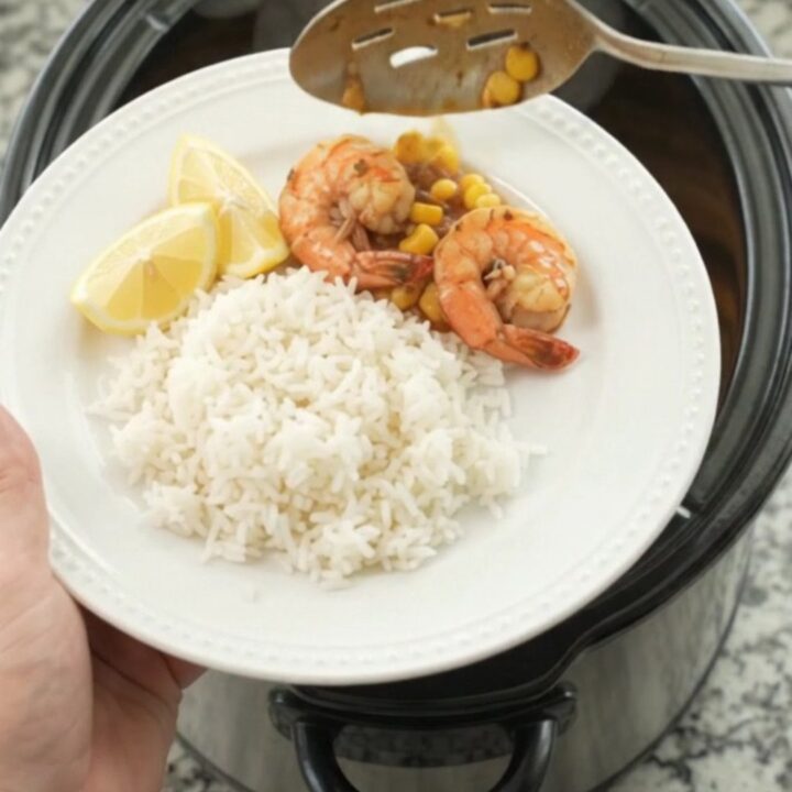 Slow cooker bayou butter garlic corn snow crab with shrimp and corn in a rich red sauce