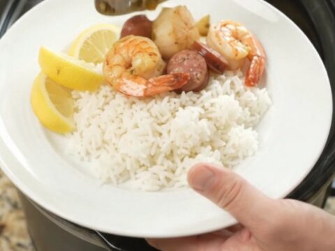 Slow cooker seafood boil with scallops, shrimp, Andouille, and potatoes in a chili-lime butter sauce