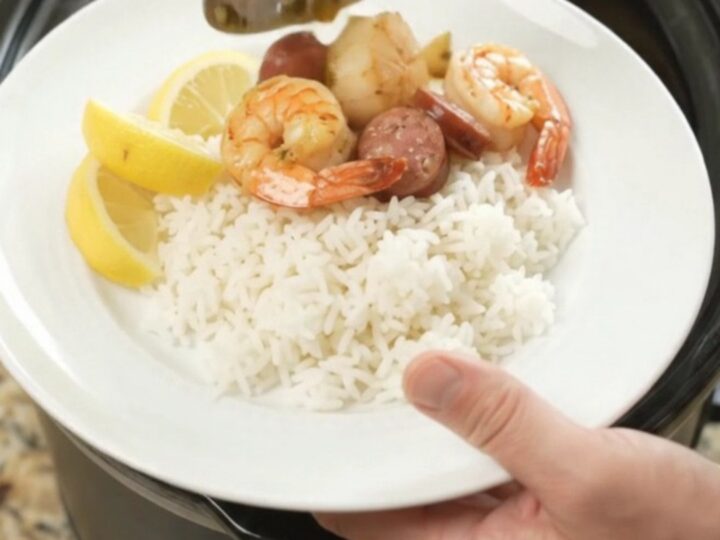 Slow cooker seafood boil with scallops, shrimp, Andouille, and potatoes in a chili-lime butter sauce