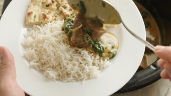 Creamy coconut spinach saag with tender beef brisket in a slow cooker