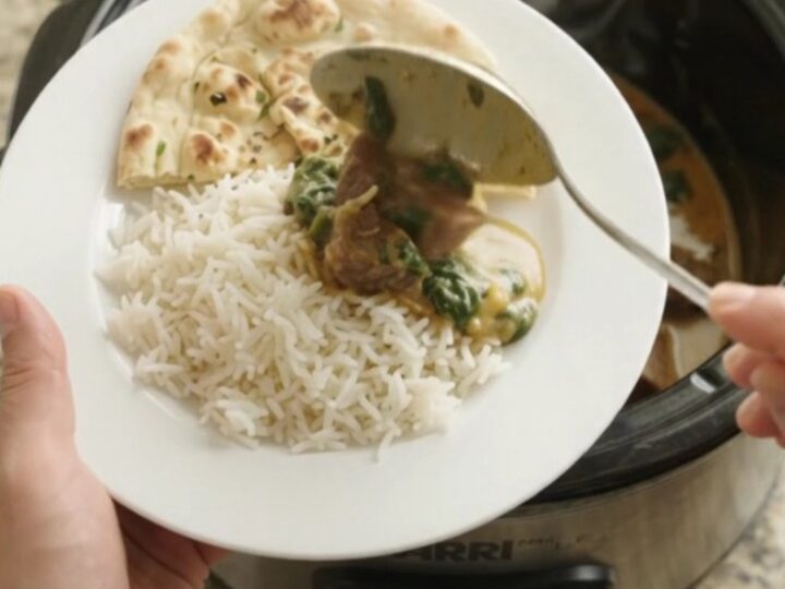 Creamy coconut spinach saag with tender beef brisket in a slow cooker