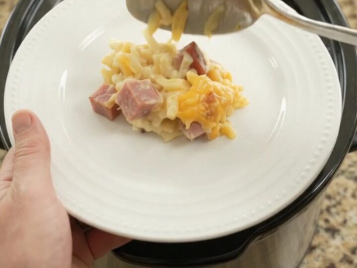 Crockpot cheddar sour cream hashbrown bake with melted cheese and ham