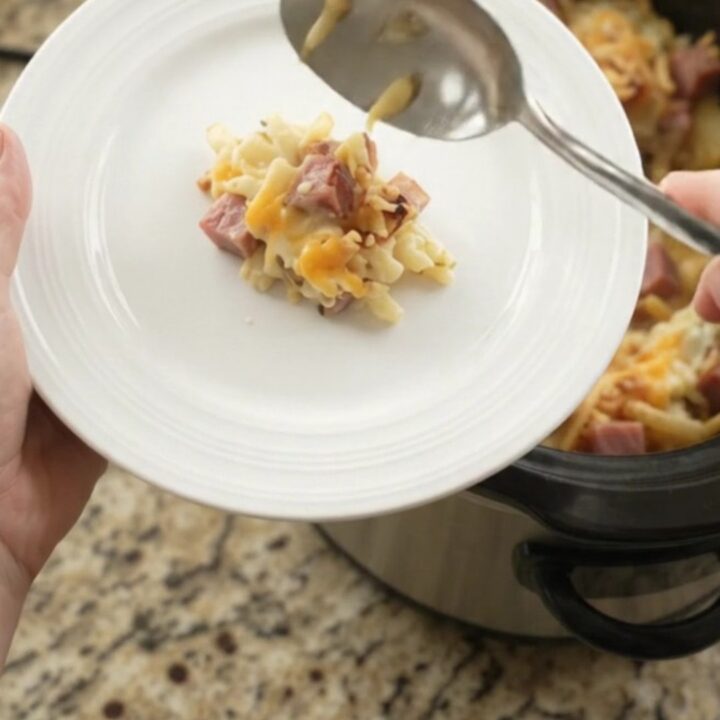 Bubbling slow cooker hashbrown bake with melted pepper jack and crispy onions
