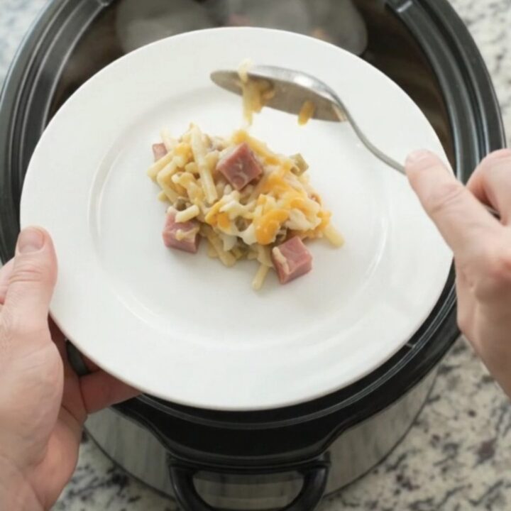 Slow cooker hashbrown bake with melted cheese and green chiles