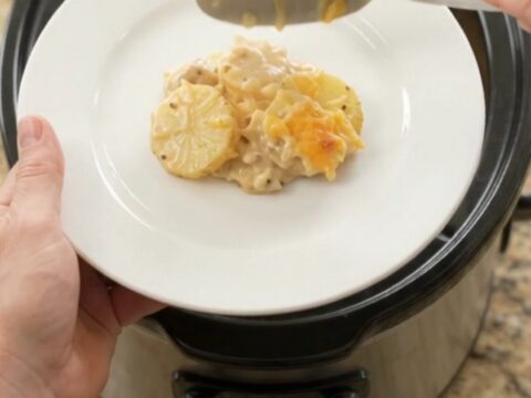 Bubbling slow-cooker casserole with golden melted cheddar and tender potato slices
