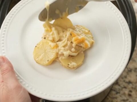 Bubbling Crockpot Colby-Jack Ranch Scalloped Potatoes with melted cheese and creamy sauce