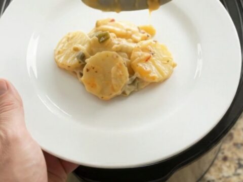 Crockpot pepper jack green chile scalloped potatoes with golden crispy onions on top