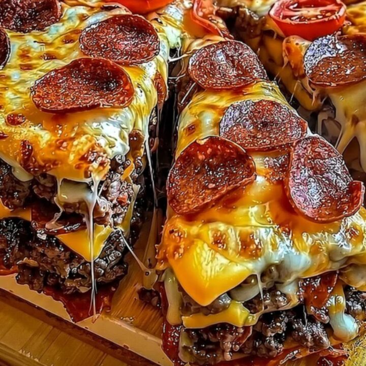 A towering deep-dish pizza pie on a wooden board with steam rising and a dramatic cheese pull.