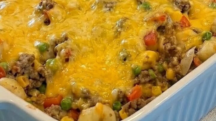 A slow push-in shot of the finished shipwreck casserole in a light blue ribbed baking dish on a kitchen counter