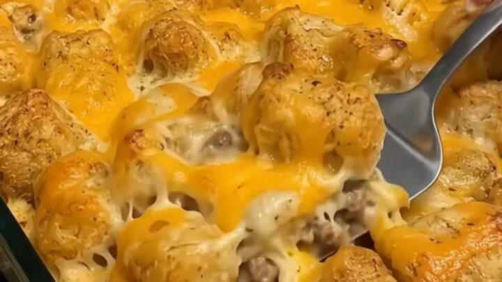 A close-up of a Cowboy Tater Tot Casserole with golden crispy tots and melted cheese.