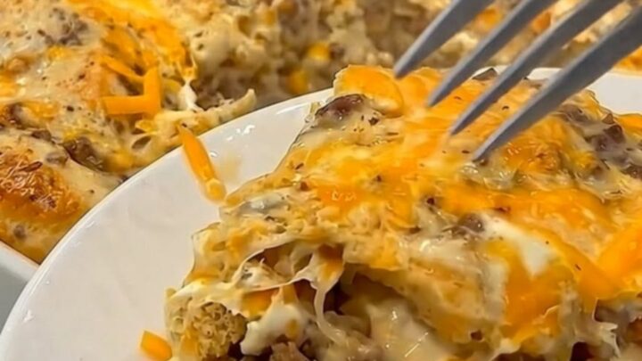 A warm, golden-brown breakfast casserole with melted cheese and sausage gravy.