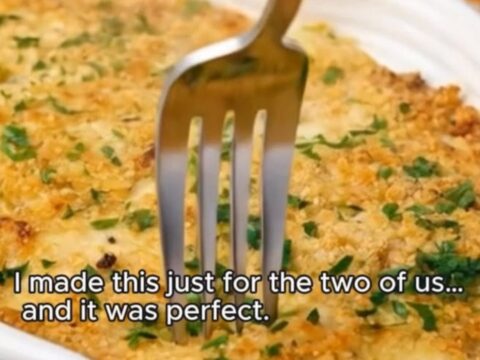 Golden panko-crusted chicken cordon bleu casserole bubbling in a fluted white dish.