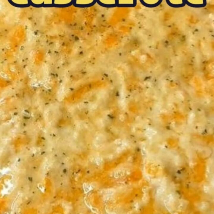 A steaming Sloppy Joe Casserole in a baking dish with a golden, cheesy biscuit crust on top.