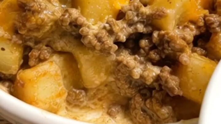 A steaming bowl of ground beef, tender potatoes, and melted cheddar cheese.