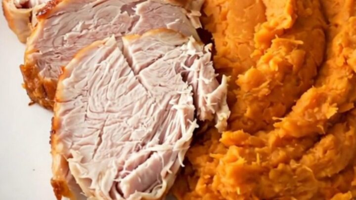 Slow cooker turkey breast and sweet potatoes served on a white plate.