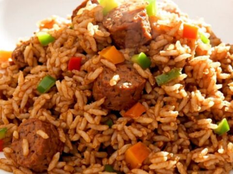 A steaming plate of slow cooker jambalaya with smoked sausage and peppers.