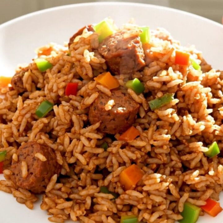 A steaming plate of slow cooker jambalaya with smoked sausage and peppers.