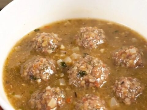 A steaming bowl of creamy Italian meatball chowder filled with tender meatballs and potato chunks.