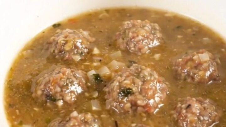 A steaming bowl of creamy Italian meatball chowder filled with tender meatballs and potato chunks.