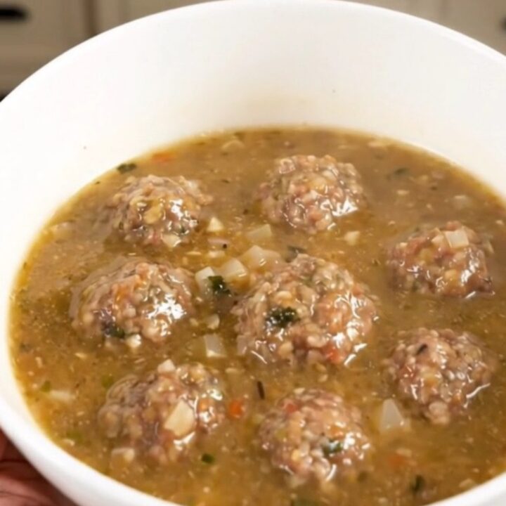 A steaming bowl of creamy Italian meatball chowder filled with tender meatballs and potato chunks.