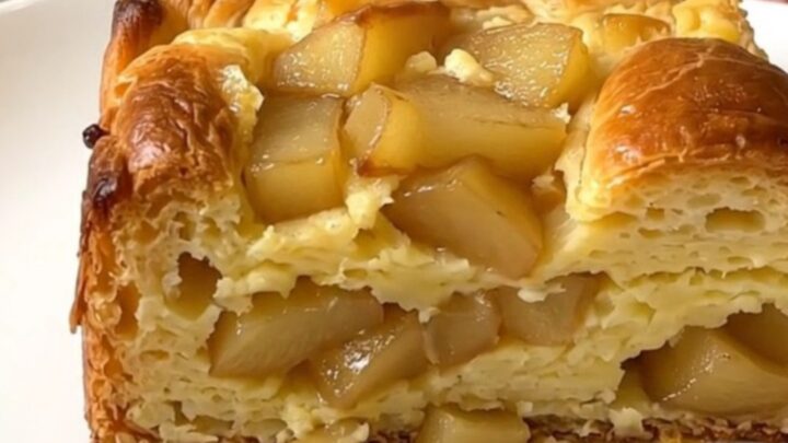 A warm, golden-brown apple cinnamon French toast casserole served on a white plate.