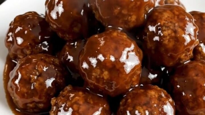 Slow cooker meatballs coated in a glossy spicy honey barbecue glaze.