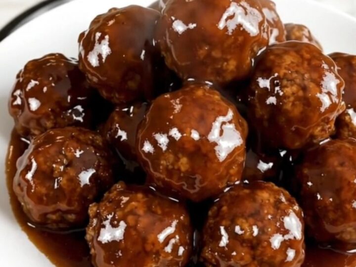Slow cooker meatballs coated in a glossy spicy honey barbecue glaze.