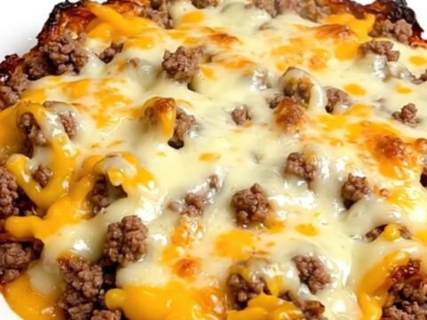 A close-up of the finished crockpot jalapeno popper beef casserole served on a white plate.