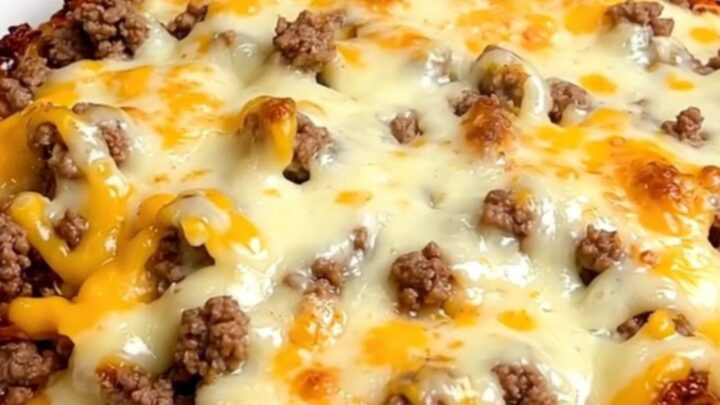 A close-up of the finished crockpot jalapeno popper beef casserole served on a white plate.