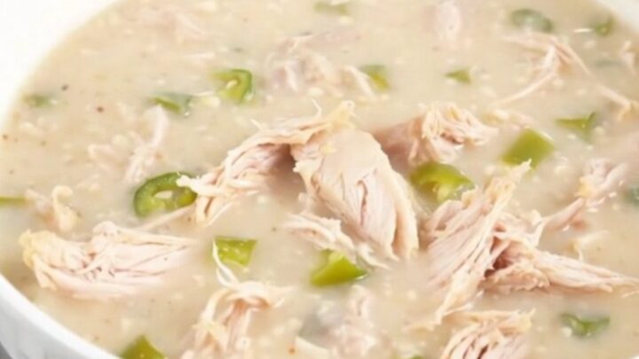 A steaming bowl of creamy green chile chicken chowder garnished with a hint of fresh cilantro.