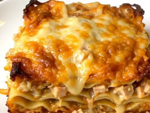 A creamy butternut squash alfredo lasagna served on a white plate.