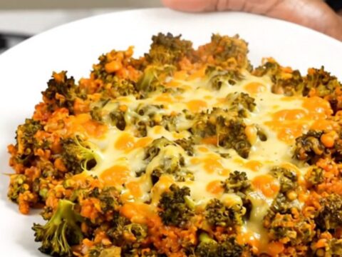 A steaming, creamy bowl of cheesy broccoli beef and rice casserole in a slow cooker.