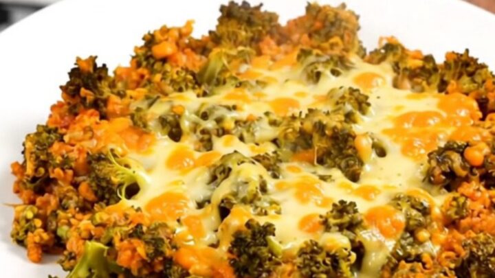 A steaming, creamy bowl of cheesy broccoli beef and rice casserole in a slow cooker.