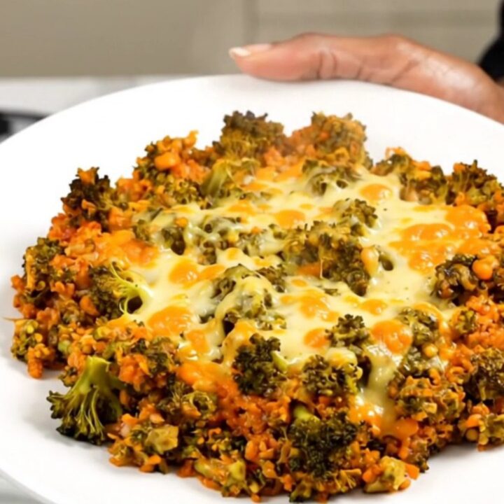 A steaming, creamy bowl of cheesy broccoli beef and rice casserole in a slow cooker.