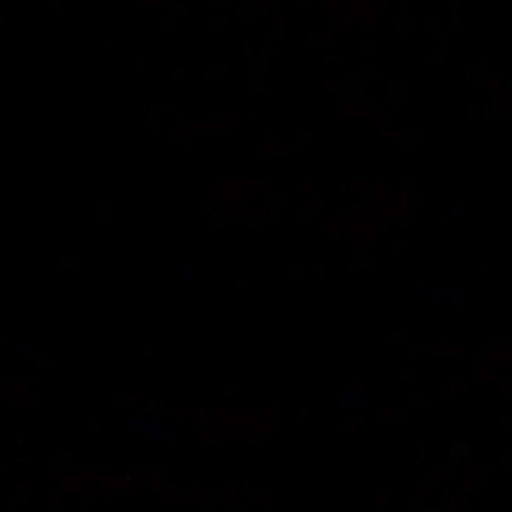 Tender caramelized honey garlic chicken drumsticks nestled in a black slow cooker, glistening with thick glaze.