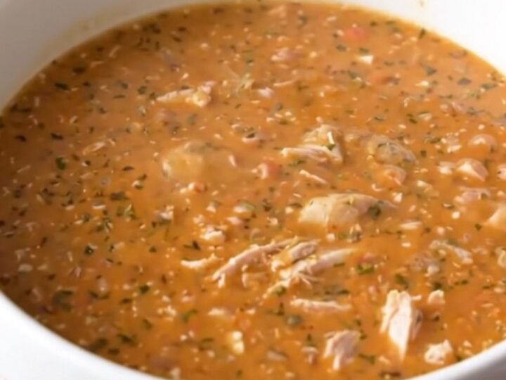 A steaming bowl of creamy buffalo turkey chowder with chunks of tender potatoes and ground turkey.