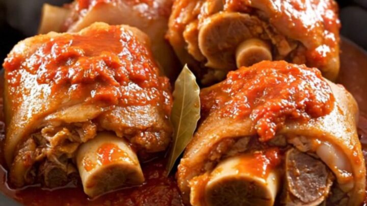 A rustic slow-cooked Provençal Pieds et Paquets dish served in a white bowl.