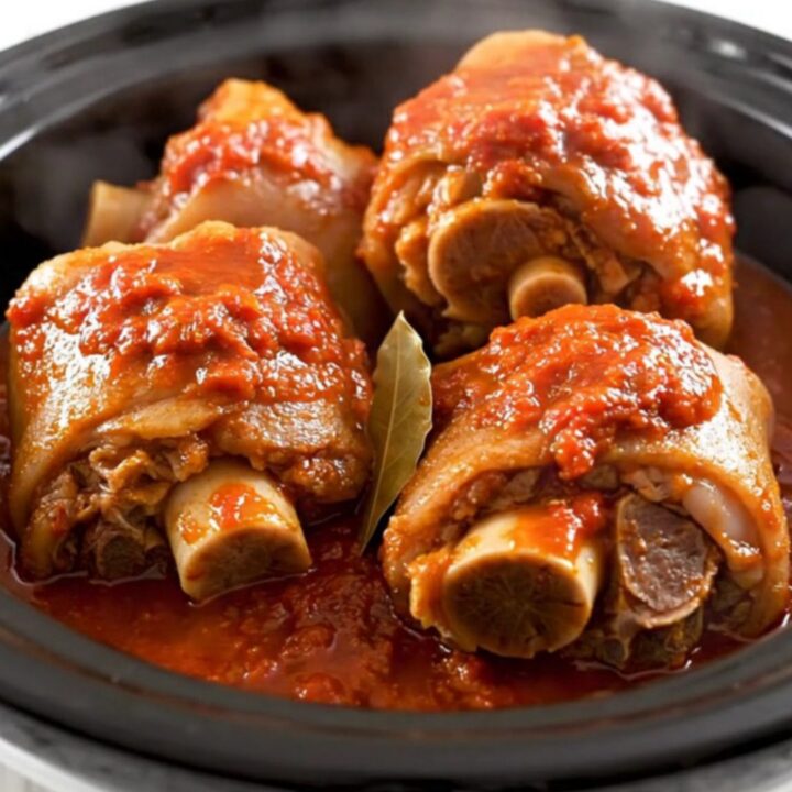 A rustic slow-cooked Provençal Pieds et Paquets dish served in a white bowl.