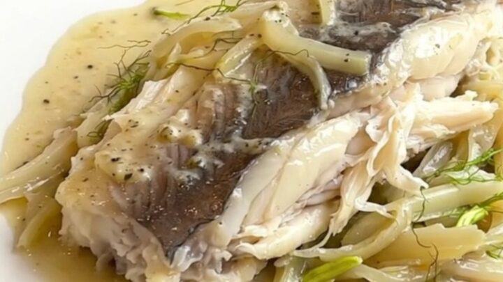 A top-down view of tender white pollack fillets braised in a rich