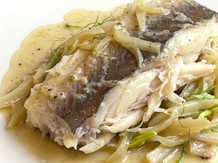 A top-down view of tender white pollack fillets braised in a rich