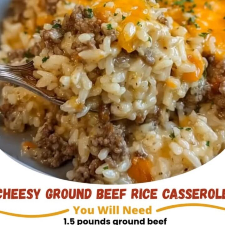 A steaming, cheesy ground beef and rice casserole in a blue dish with melted cheddar and parsley.