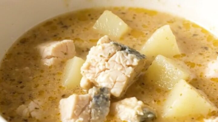 A rustic bowl of Charente fish and potato chowder with fresh herbs and a light, clear broth.
