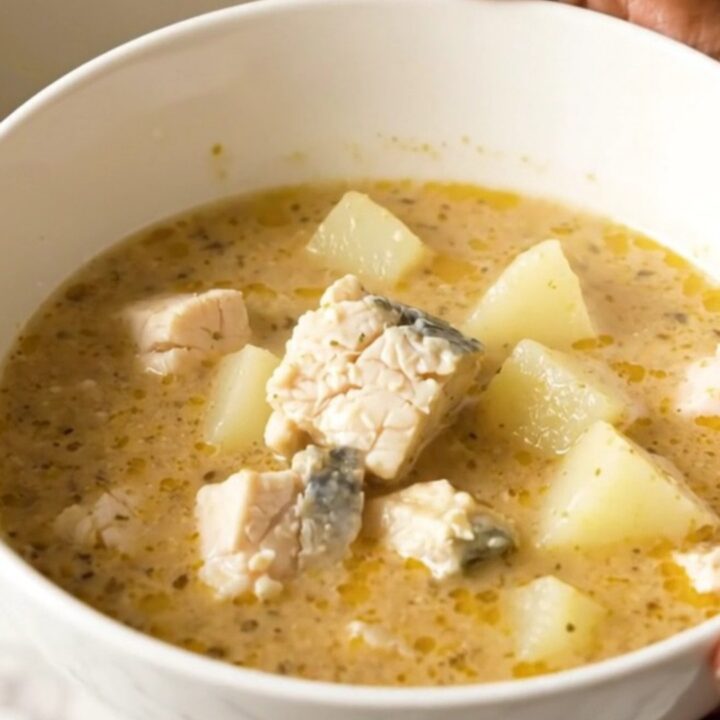 A rustic bowl of Charente fish and potato chowder with fresh herbs and a light, clear broth.