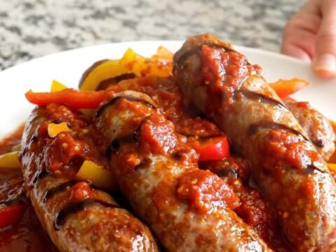 Slow cooked Italian sausages with colorful bell peppers and onions in a rich balsamic tomato sauce.
