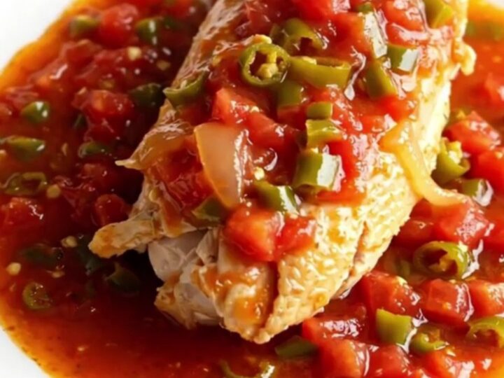A top-down view of a rectangular baker filled with ground turkey, cabbage, marinara sauce, and melted mozzarella cheese.