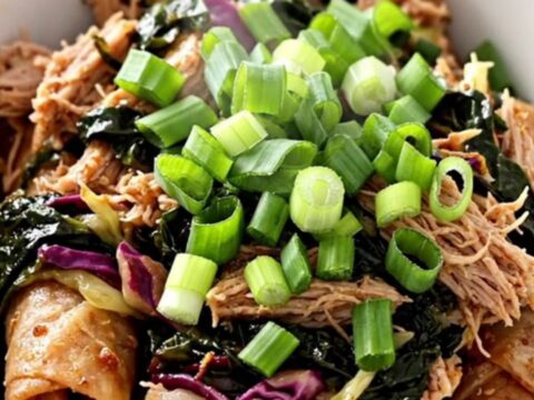 A slow cooker filled with cooked ground turkey and shredded cabbage, ready to be served.