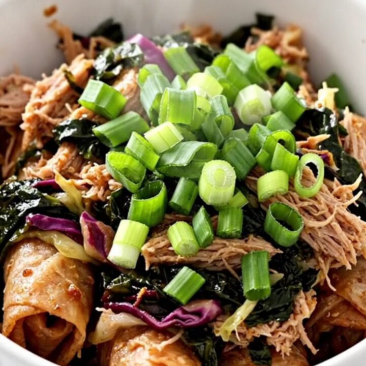 A slow cooker filled with cooked ground turkey and shredded cabbage, ready to be served.